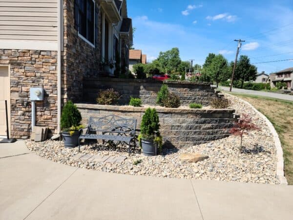 small retaining wall creates nice area that works with grade of the yard