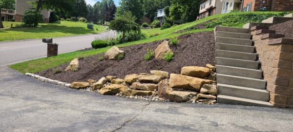 large rock used to retain slope