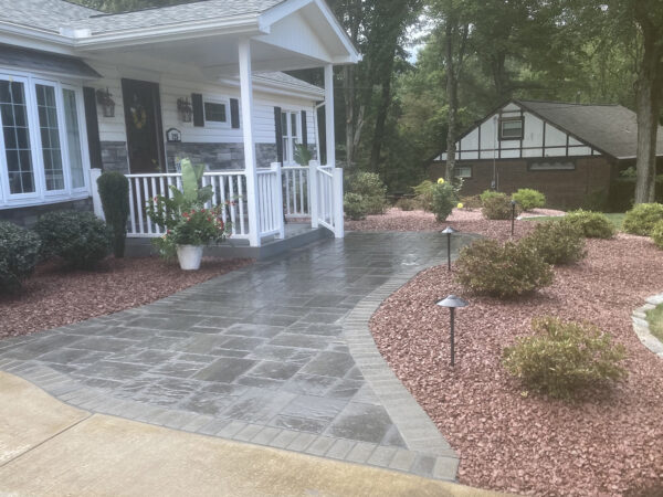 paver stone sidewalk leading to porch